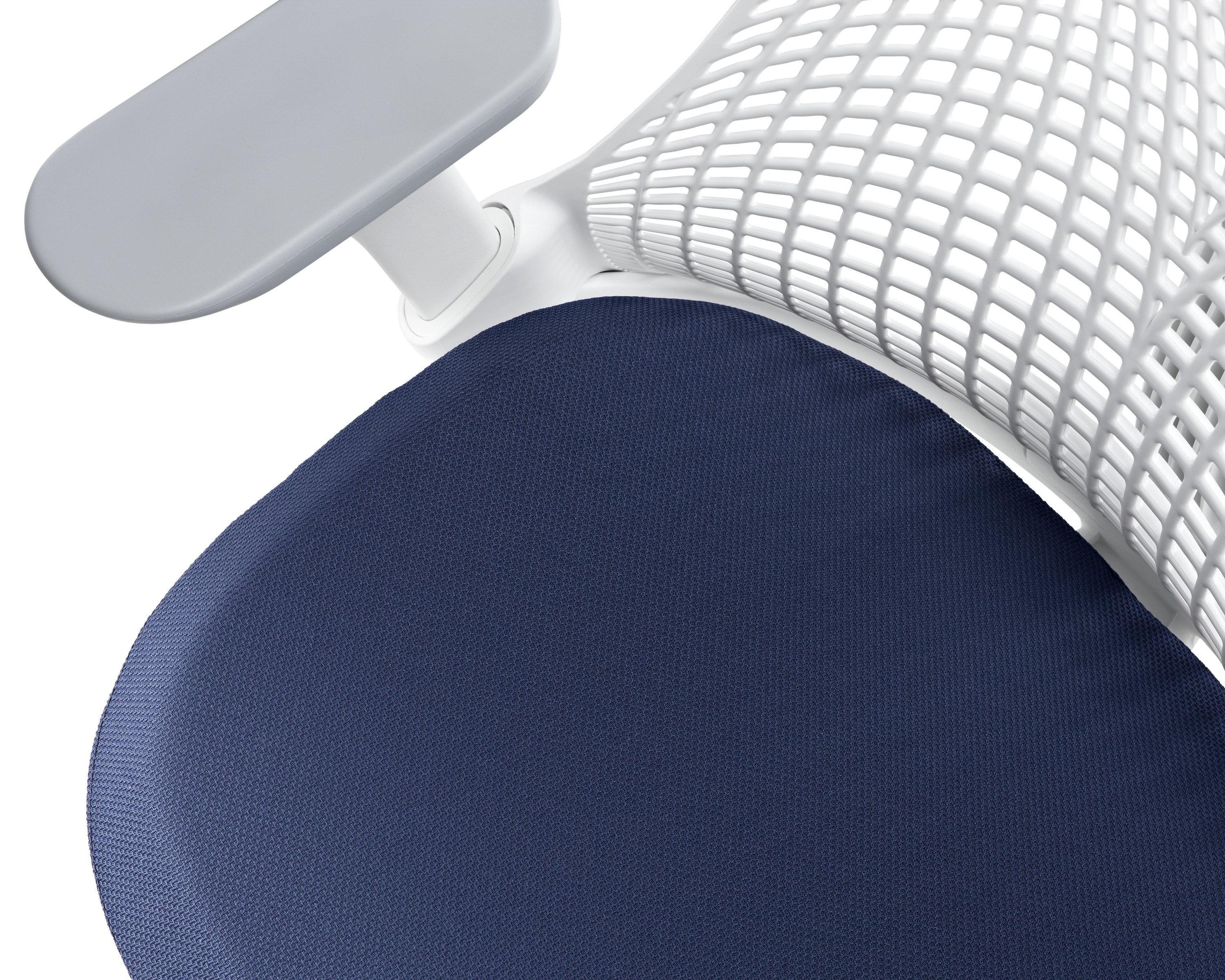 close up of blue upholstered seat and white backrest on sayl chair